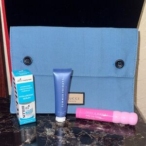 Skincare bundle includes Gucci toiletry bag, Hyaluronic serum, mask & Lip gloss